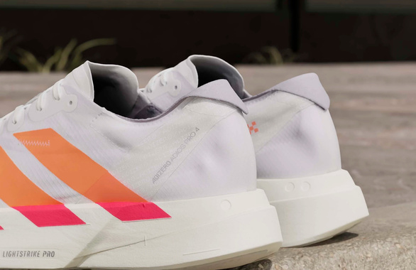 Buty Adidas Adizero Adios Pro 4 biało-pomarańczowo męskie SS26